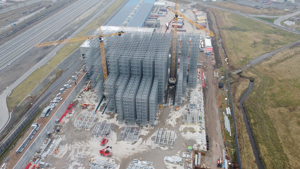 High-bay warehouses are constructed from the inside out – placing significant demands on the steels used